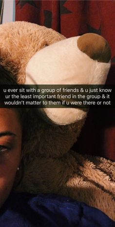 a woman laying in bed with a teddy bear on her head and the caption reads, i never sit with a group of friends & u just know