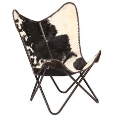 a black and white chair with cow hide on it's back legs, sitting in front of a white background