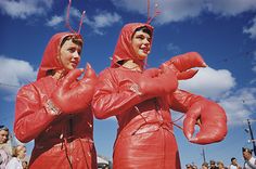 two people in red costumes standing next to each other