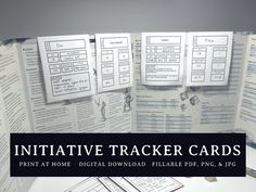 a table with some papers on it and the words, infinative tracker cards