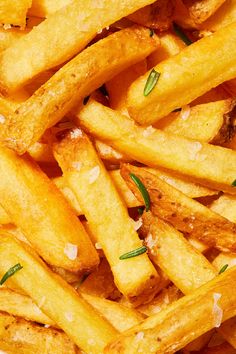 french fries with herbs and seasoning on top