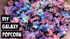 a bowl full of colorful popcorn with the words diy galaxy popcorn