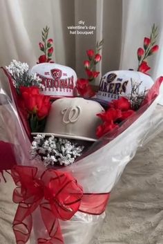 a baseball hat and flowers in a basket