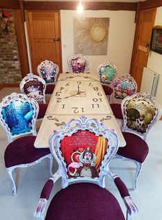 a dining room table with many chairs around it