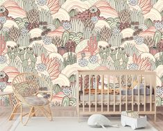 a baby's room with a crib and wallpaper