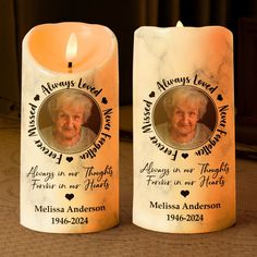 two candles that have been placed next to each other on a table with a memorial candle