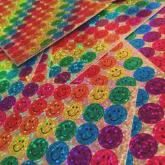 colorful sequinized stickers with smiley faces on them