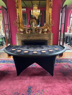 a black table in front of a mirror