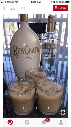 three glasses filled with ice cream next to a bottle of rumchata