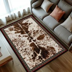 a living room with a couch and rug on the floor