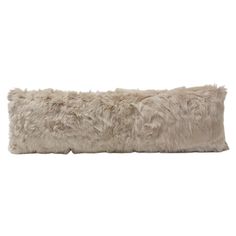 a long furry pillow on a white background