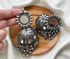 Add elegance and sophistication to any casual day with these silver-toned handcrafted Metal Jhumkies. It's a beautiful pair of handcrafted oxidized silver metal alloy jhumki embellished with Ghungroo and Mirrors. Base Metal- Alloy, Silver, Brass Plating- German Silver Stone- Mirror Sizing-Non Adjustable Type- Jhumka Earring Light Weight Recycled Item Skin Friendly- Lead & Nickel Free in compliance with all International Requirements. Gift - Ideal Valentine, Birthday, Anniversary gift for someone Mirror Jhumka, Oxidised Jhumka, Silver Jhumkas, Stone Mirror, Oversized Earrings, Fancy Jewellery Designs, Silver Jewellery Indian, Indian Jewelry Sets, Valentine Birthday