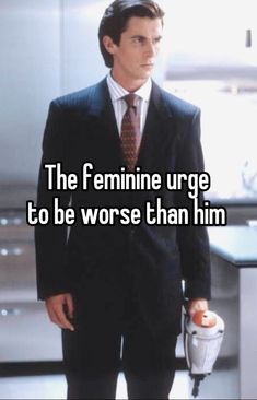 a man in a suit and tie with the words the feminine urge to be worse than him