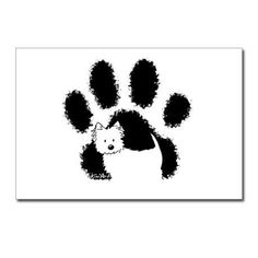 a black and white dog paw print with an animal's head in the center