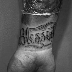 a person's hand with a tattoo on it that says, blasssoe