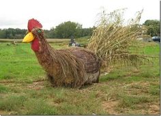 a chicken made out of hay in a field