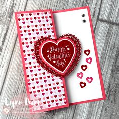 a valentine's day card with two hearts on it and the words happy valentine's day