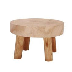 a small wooden stool sitting on top of a white floor