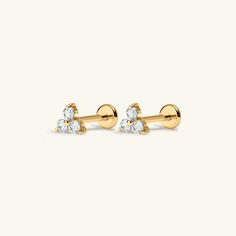 two diamond stud earrings in yellow gold