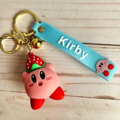 a keychain with a cartoon character on it and a name tag attached to it