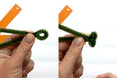 two hands are holding scissors and some green grass in front of the same person's hand