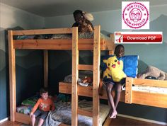 two children sitting on bunk beds in a room