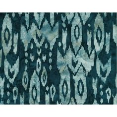 a blue and white area rug with an abstract design