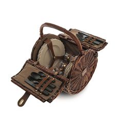 a wicker picnic basket with utensils in it and the words alessi above it