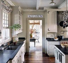 the kitchen is clean and ready for us to use it's counters, stoves, and cabinets