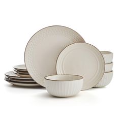 the white dishes are stacked on top of each other