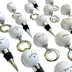 several golf balls and tees are being used as key chains