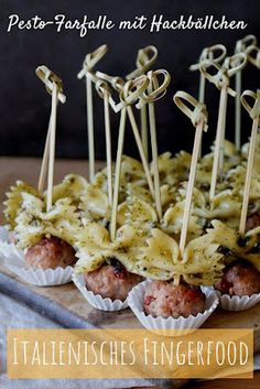 some meatballs with sauce and toothpicks on them