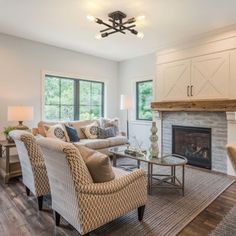 a living room filled with furniture and a fire place