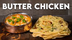 butter chicken and tortilla bread on a wooden table with a bowl of dip