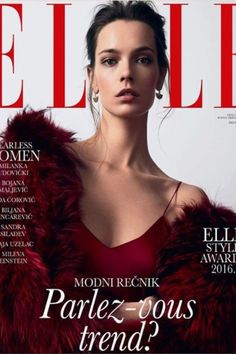 a magazine cover with a woman in a red dress and fur stoler on it