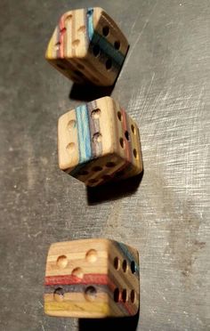 three wooden dices sitting on top of a table