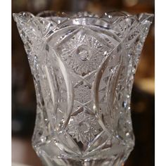 a clear glass vase sitting on top of a table