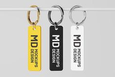 three keychains with different designs on them