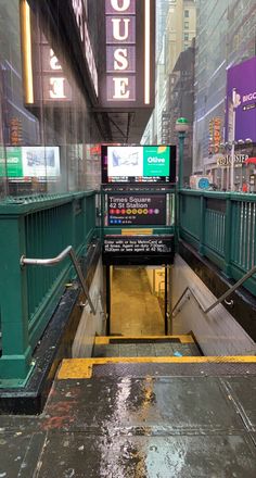 an empty subway station in the rain