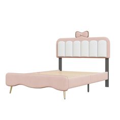 a pink bed with a bow on the headboard and foot board, in front of a white background