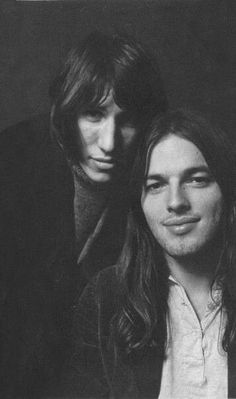 two young men are posing for a black and white photo