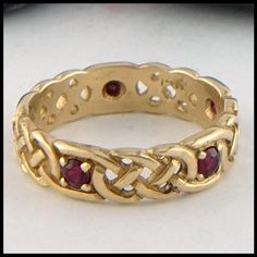 The Josephine's Knot Celtic Gold Ring with Gemstones is vailable in 14K Yellow, Rose or White Gold. We will set the band with your choice of Diamond, Tsavorite, Ruby, or Sapphire.The Josephine's knot is a traditional lover's knot. The strands intertwine continuously around the band to symbolize eternal love. Makes perfect stacking rings. Item number: R63 Original designs © Stephen WalkerPlease call or email for more information800.488.6347 or service@walkermetalsmiths.com