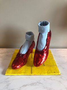 The Wizard of Oz Ruby Slipper Replicas SHOES ONLY! DISPLAY STAND AND SOCKS ARE NOT INCLUDED! These are a pair of handmade Ruby Slipper replicas from the film The Wizard Of Oz! These replicas were carefully crafted to match the original Ruby Slippers worn by Judy Garland! These shoes include painted red soles, custom bows with hand-sewn rhinestones and bugle beads, and the Innes shoe company logo on the inside sole! These shoes can be made in sizes 5 or 6 to be even more accurate to the original Ruby Slippers Wizard Of Oz, Wizard Of Oz Movie, Wizard Of Oz Dorothy, Ruby Slipper, Wicked Costumes, Wizard Of Oz 1939, Ruby Red Slippers, Witch Shoes, Ruby Slippers