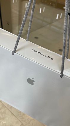 an apple macbook pro sitting on top of a table