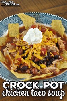 crock pot chicken taco soup on a plate with tortilla chips and sour cream