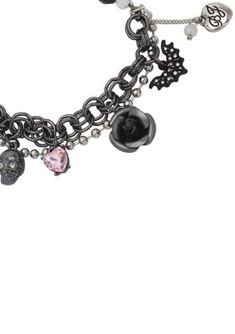 Whimsical mixed media bracelet featuring faceted bead stretch strand paired with hematite-tone finish chains, and playful charms including the skull, bat, stone heart, and rose. The bracelet has an easy stretch closure. Made from metal and glass. | Betsey Johnson Skull Charm Stretch Bracelet Goth Charm Bracelet, Easy Stretches, The Skull, Stone Heart, Faceted Bead, Stretch Bracelet, Resin Jewelry, Stretch Bracelets, Betsey Johnson