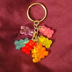 a bunch of gummy bears that are on a keychain or bag charm