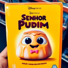 a person holding up a dvd cover for the movie sehnor pudim