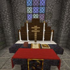 a room with a red table in front of a stained glass window and an altar