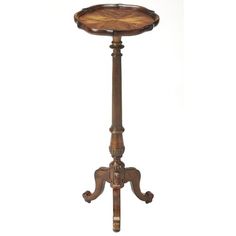 an antique wooden table with two legs and a tray on the top that is turned upside down